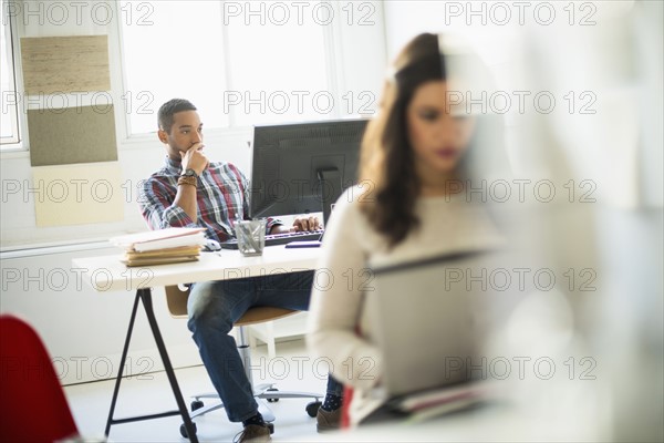Businessman concentrating in office.