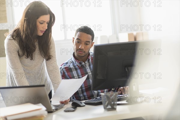 Business couple working in office.