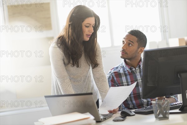 Business couple working in office.