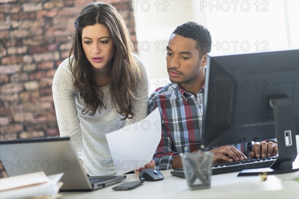 Business couple working in office.