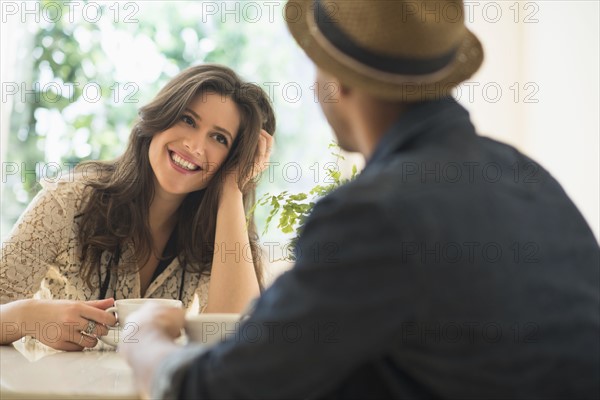 Couple sitting at table.