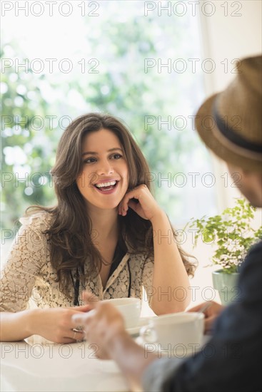 Couple sitting at table.