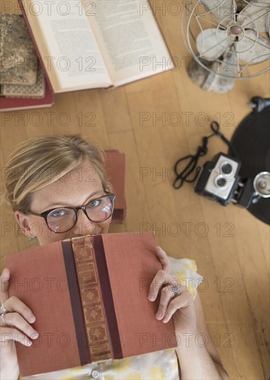 Woman lying down on floor and peeking.