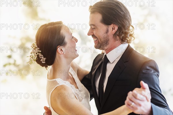 Bride and groom dancing.