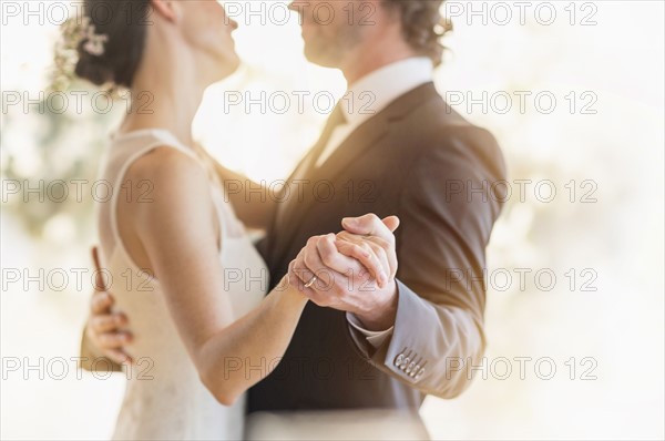 Bride and groom dancing.