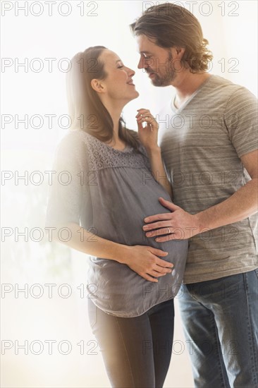 Happy man and his pregnant woman.