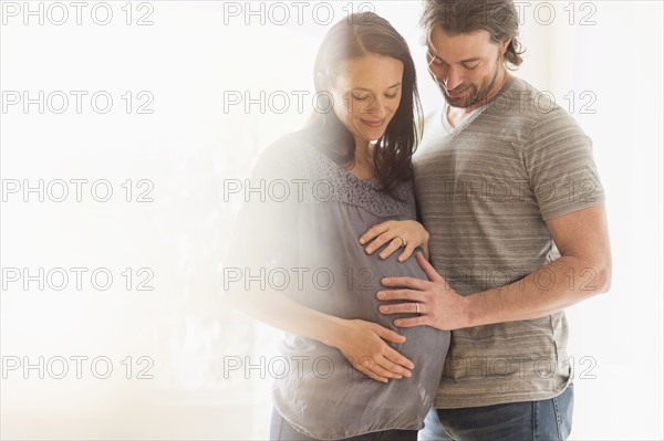 Happy man and his pregnant woman.