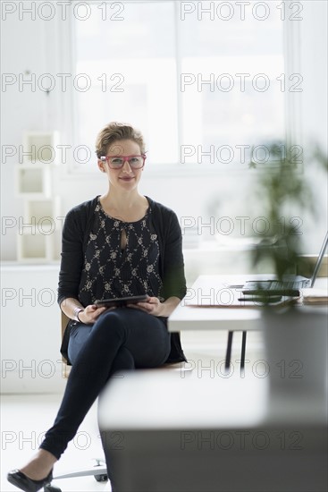 Portrait of businesswoman in office.