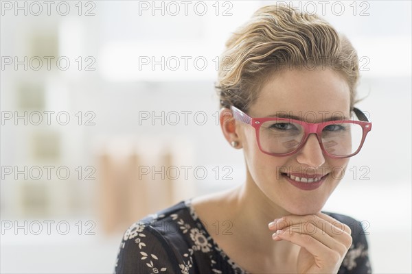 Portrait of young woman wearing glasses.