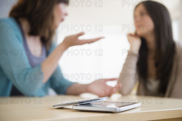 Teenage girl (14-15) listening to lecture at home