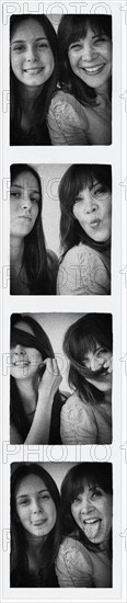 Photo booth picture of teenage girl (14-15) and her mom