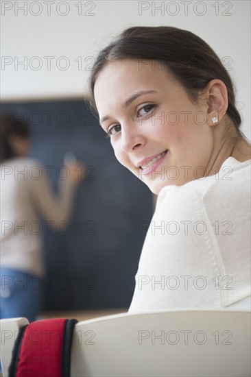 Portrait of teenage student (14-15) in classroom