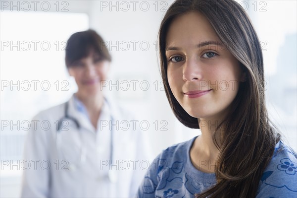 Portrait of patient (14-15) in doctor's office