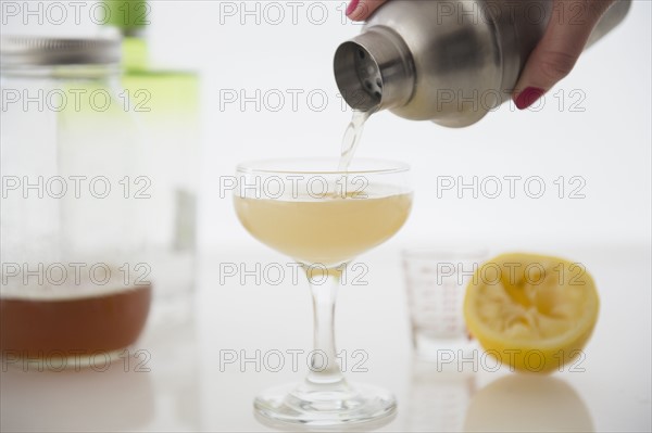 Woman pouring cocktail