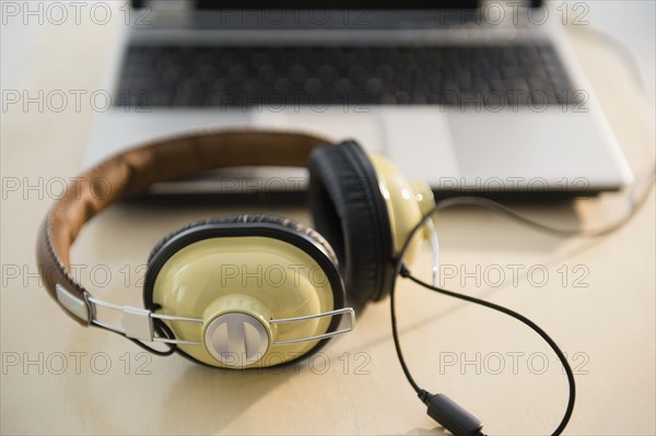 Headphones and laptop on table