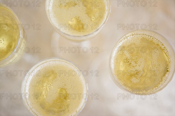 Directly above view of champagne flutes