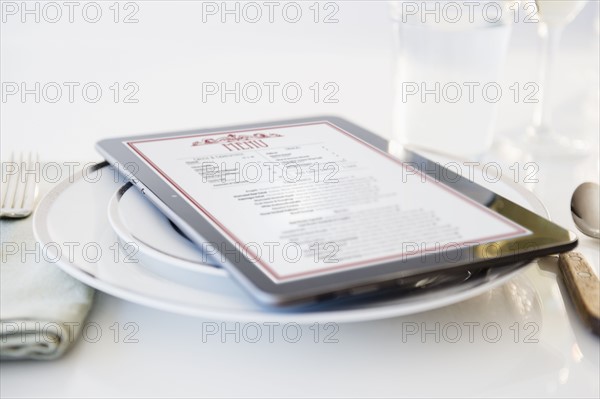 Digital tablet on plate