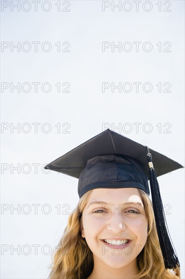 Girl (12-13) in graduation cap