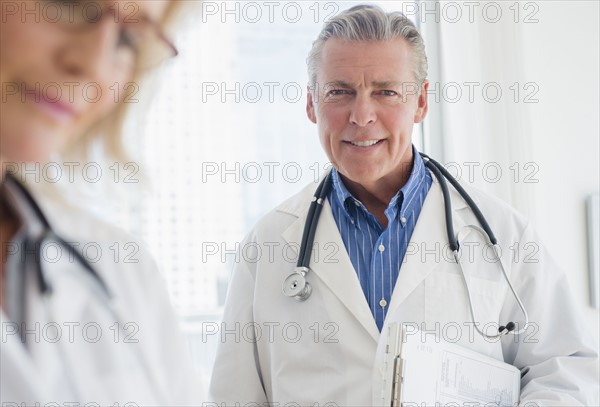 Portrait of smiling male doctor with stethoscope