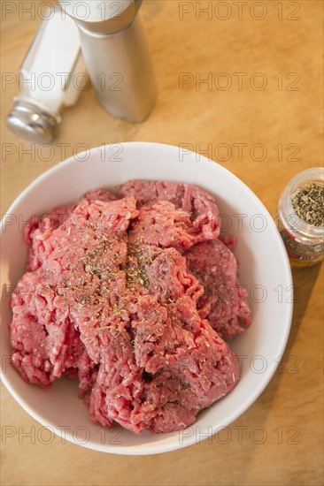 Close-up shot of peppered ground beef in white bowl