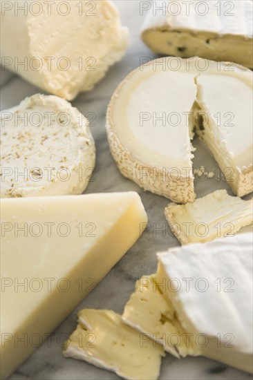 Studio shot of varied cheese slices