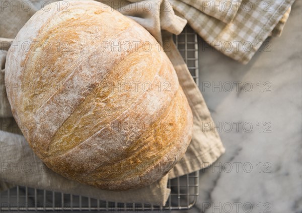 Studio shot of bread on dishcloth