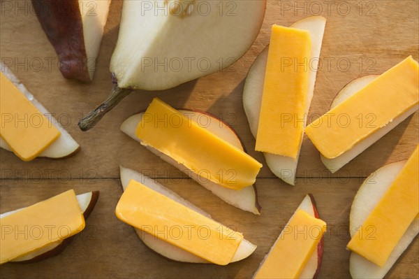 Studio shot of pear slices with cheddar cheese