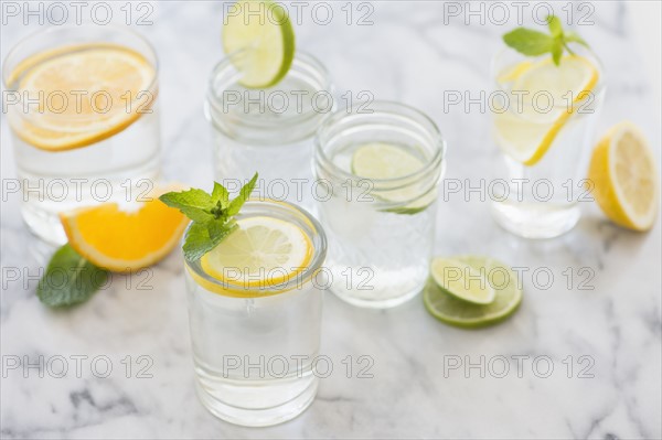 Studio shot of drinks with lemon, lime and orange