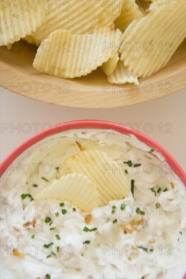 Studio shot of crisps and onion dip