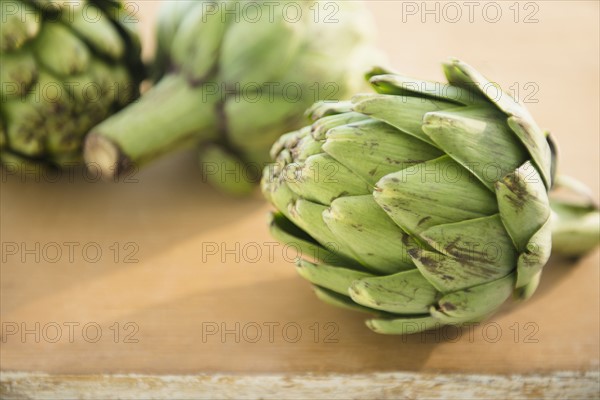 Studio shot of artichokes on table