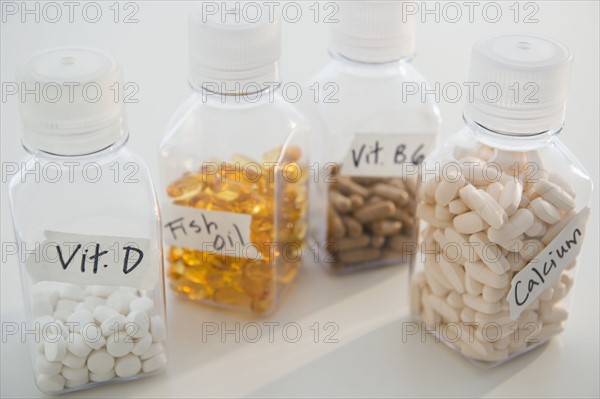 Studio shot of various pills in bottles