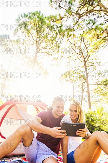 Couple looking at digital tablet