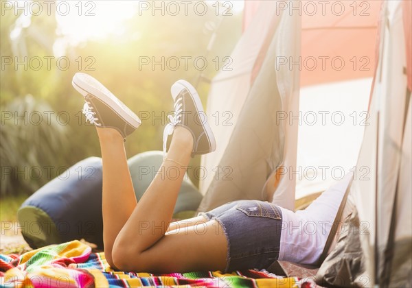 Woman lying in tent