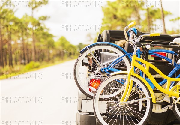 Couple in car with bike rack