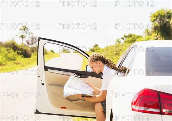 Young man checking map