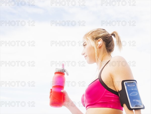 Woman drinking water from bottle