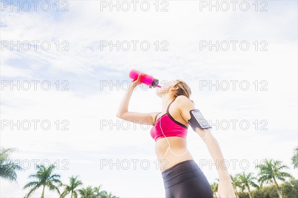 Woman drinking water from bottle