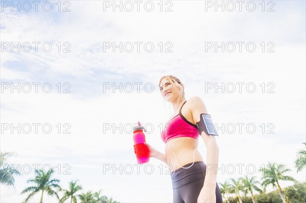 Woman drinking water from bottle