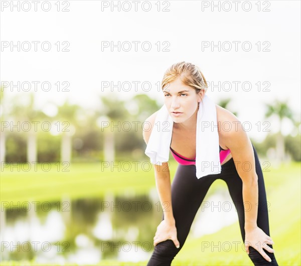 Young woman resting during work-out