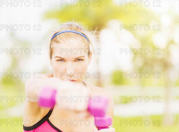 Young woman exercising in park