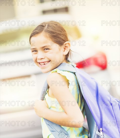 Portrait of smiling student (6-7) outdoors