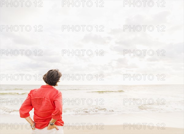 Rear view of woman looking at ocean