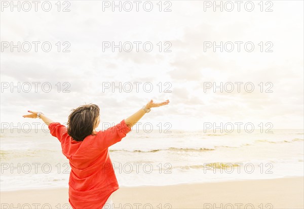 Rear view of woman looking at ocean