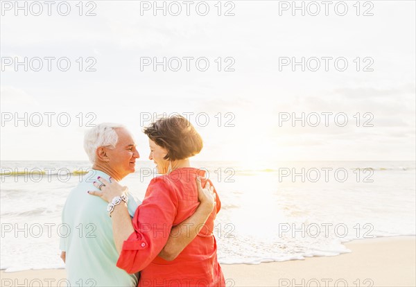 Older couple spending time together on beach