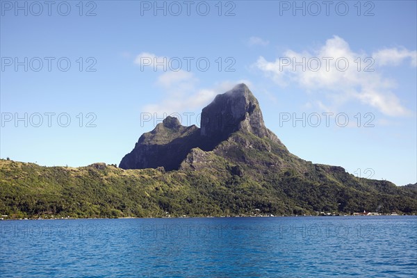 Landscape with rocky mountains and calm sea