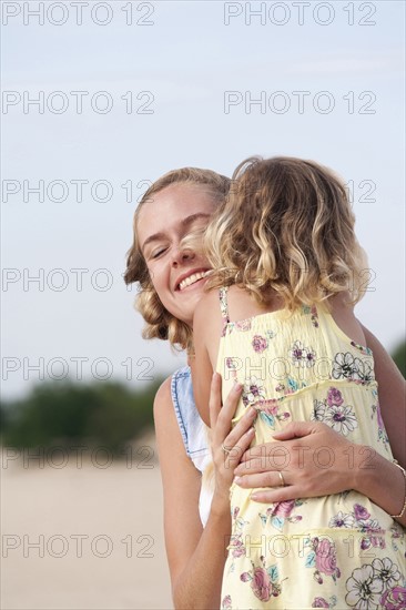 Mother playing with daughter (2-3)