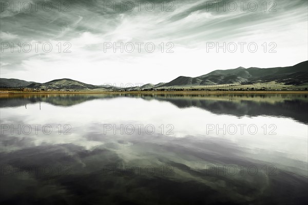 Landscape with mountain range and calm lake
