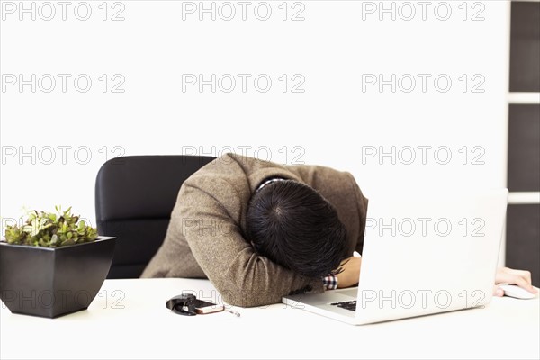 Businessman sleeping in office