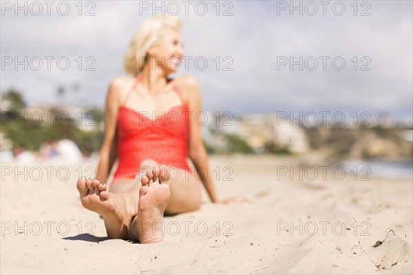 Portrait of blond woman on beach