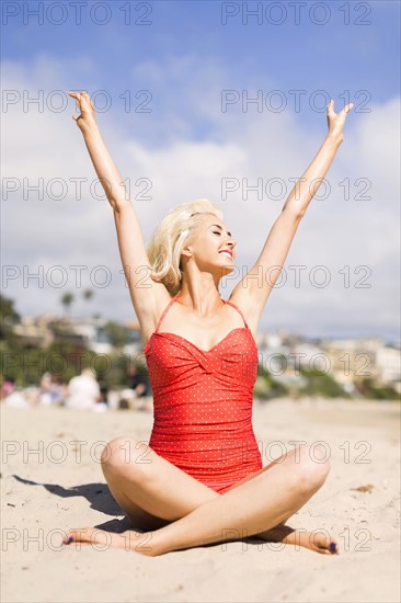 Portrait of blond woman on beach